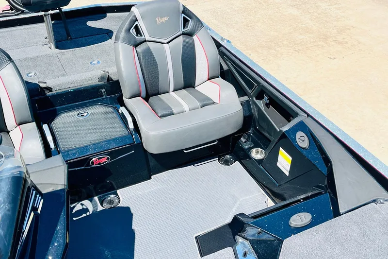 Slide: The Image of 2024 Ranger Z521R Ranger Cup boat interior with premium seating and storage compartments. - 31