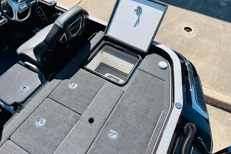 Slide: The Image of 2024 Ranger Z521R Ranger Cup Equipped boat interior with open storage compartment. - 50