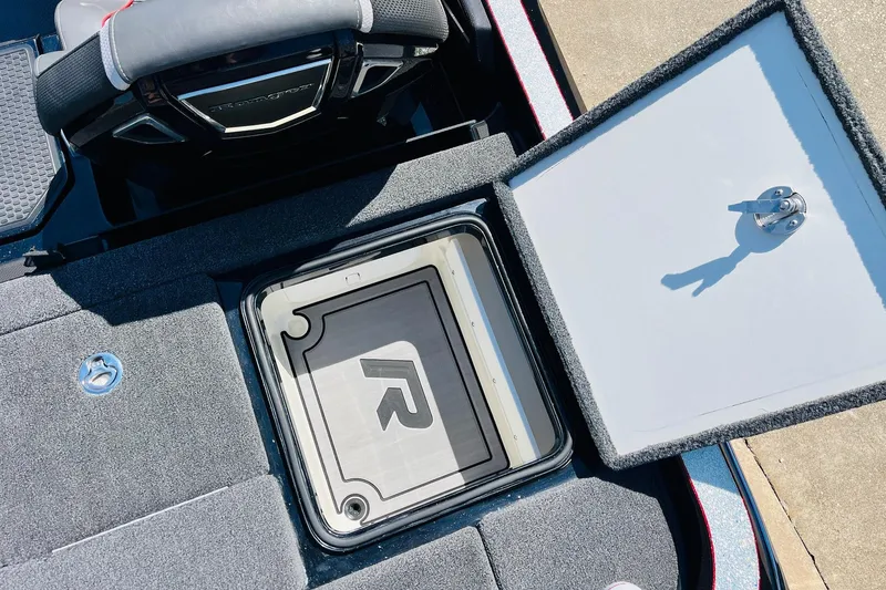 Slide: The Image of 2024 Ranger Z521R Ranger Cup Equipped boat storage compartment open, showcasing interior design. - 51