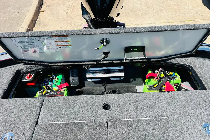 Slide: The Image of 2024 Ranger Z521R Ranger Cup Equipped boat battery compartment with wiring and components. - 53