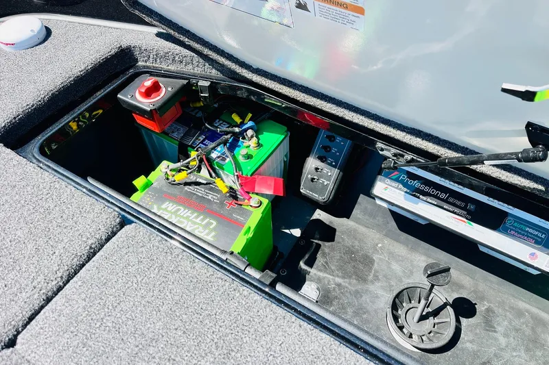Slide: The Image of 2024 Ranger Z521R Ranger Cup Equipped boat battery compartment with lithium battery setup. - 54