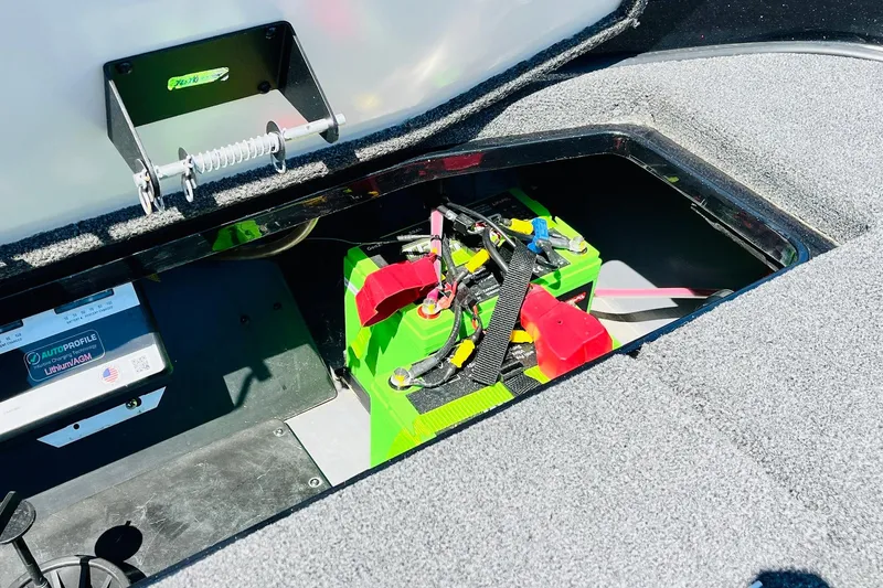 Slide: The Image of 2024 Ranger Z521R Ranger Cup Equipped boat battery compartment with lithium battery setup. - 55