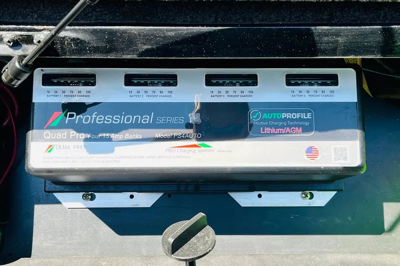 Slide: The Image of Battery charger in 2024 Ranger Z521R boat, featuring Quad Pro four 15 amp banks. - 56