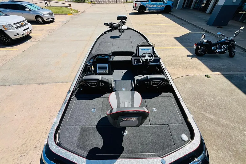Slide: The Image of 2024 Ranger Z521R Ranger Cup Equipped boat, parked outdoors, showcasing interior and dashboard. - 8