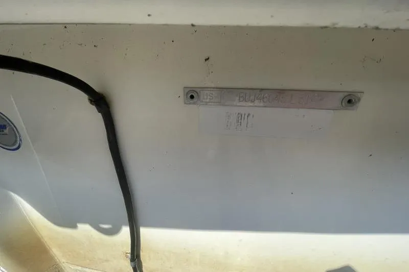 Slide: The Image of 2014 Mako Pro Skiff 17 CC hull identification number plate. - 4