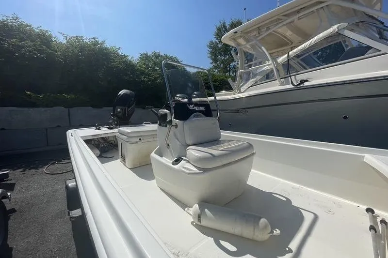 Slide: The Image of 2014 Mako Pro Skiff 17 CC boat with center console and outboard motor. - 6