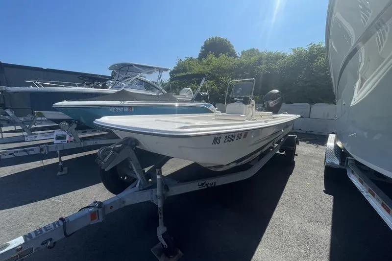 Slide: The Image of 2014 Mako Pro Skiff 17 CC on trailer in outdoor lot. - 7