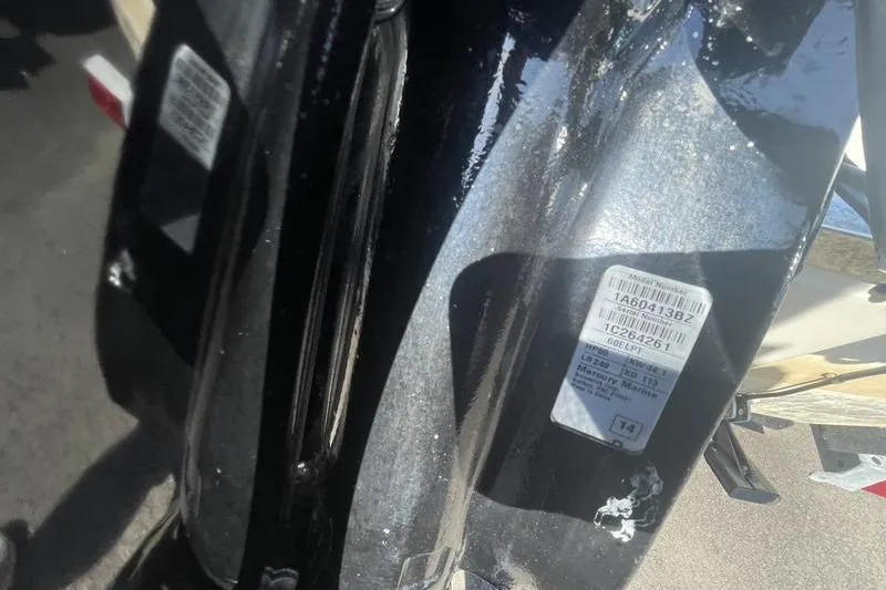 Slide: The Image of Close-up of a 2014 Mako Pro Skiff 17 CC boat's identification labels. - 8