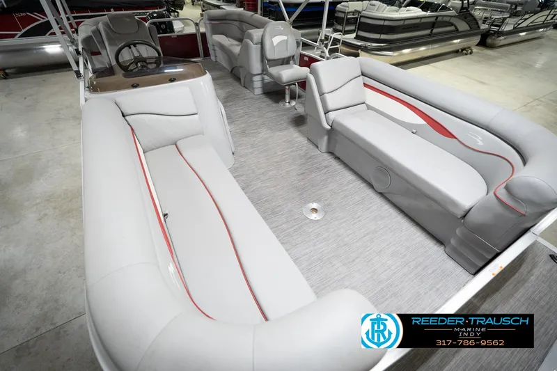 Slide: The Image of 2021 Bennington 20 SVSR pontoon boat interior with gray seating and steering console. - 13