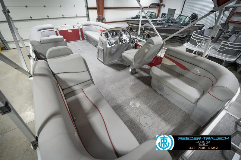 Slide: The Image of 2021 Bennington 20 SVSR pontoon boat interior with gray seating and modern dashboard. - 15
