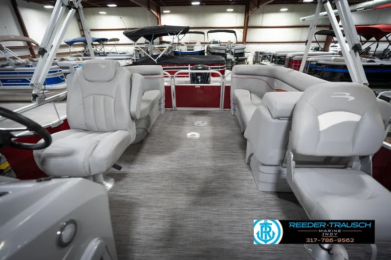 Slide: The Image of 2021 Bennington 20 SVSR pontoon boat interior with gray seating and spacious layout. - 17