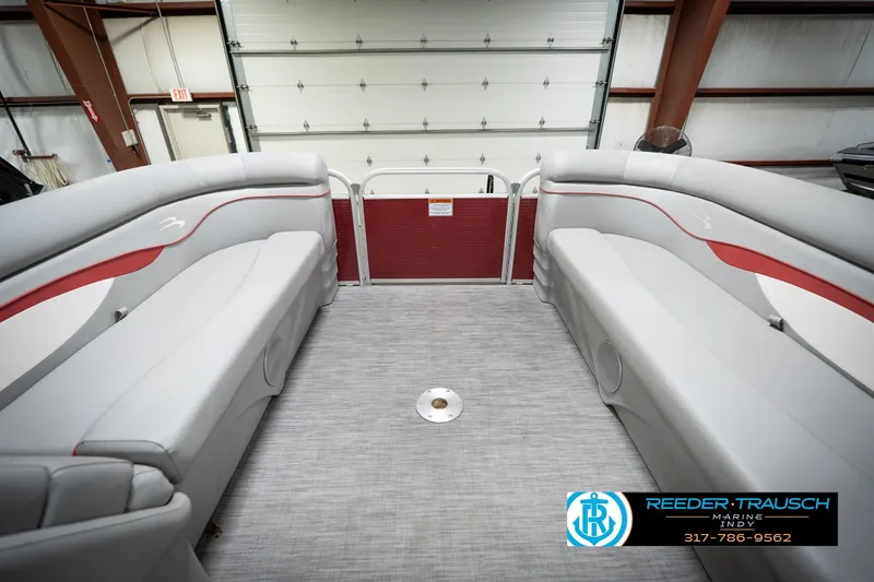 Slide: The Image of Interior of a 2021 Bennington 20 SVSR pontoon boat with gray seating. - 21