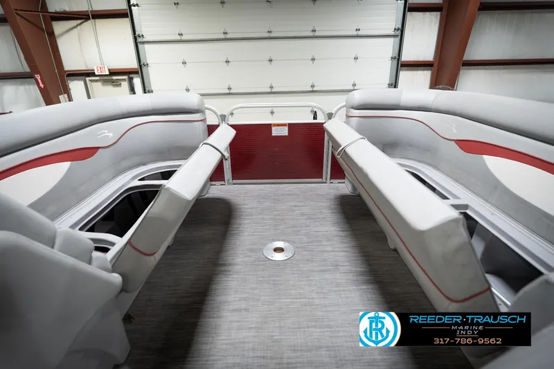 Slide: The Image of 2021 Bennington 20 SVSR pontoon boat interior with gray and red seating. - 22
