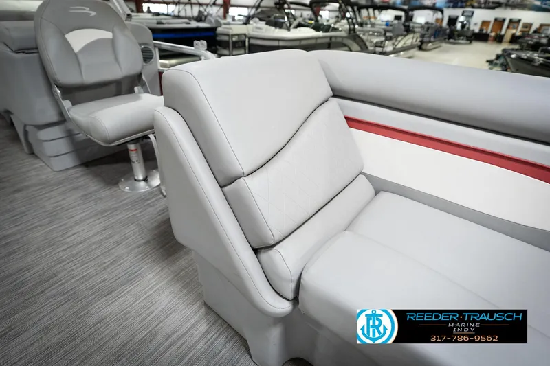 Slide: The Image of 2021 Bennington 20 SVSR boat interior with gray seating and red accent. - 23