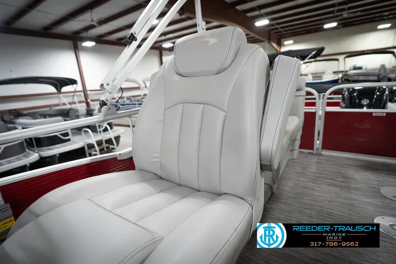 Slide: The Image of 2021 Bennington 20 SVSR boat interior with plush white seating in showroom. - 25