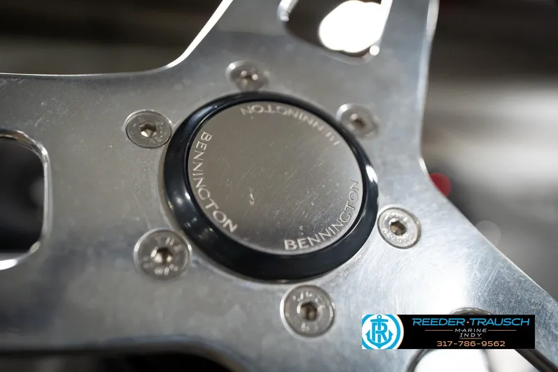 Slide: The Image of Close-up of 2021 Bennington 20 SVSR steering wheel detail with logo. - 31
