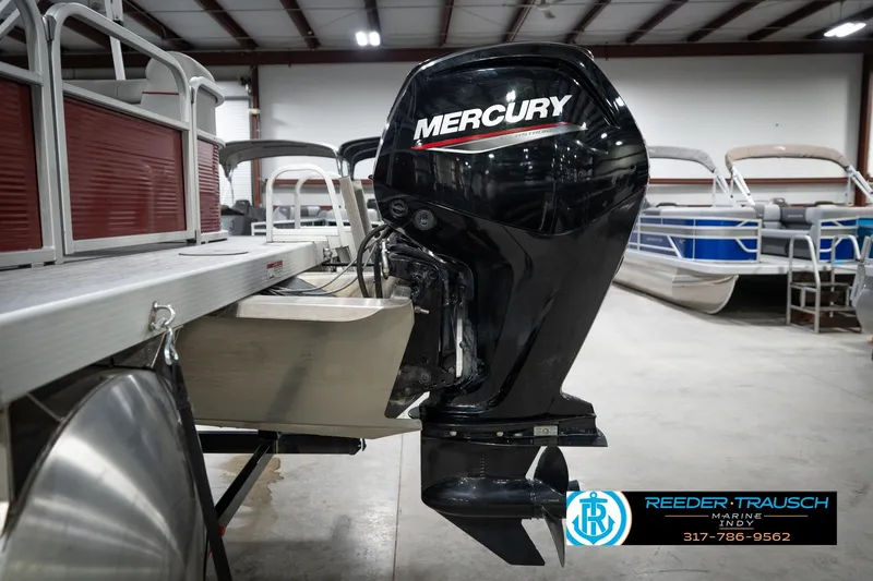 Slide: The Image of 2021 Bennington 20 SVSR pontoon boat with Mercury outboard motor in showroom. - 50