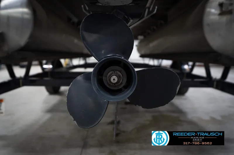 Slide: The Image of Propeller of 2021 Bennington 20 SVSR pontoon boat in a garage setting. - 54