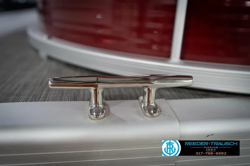 Slide: The Image of Close-up of a 2021 Bennington 20 SVSR boat cleat with red and white detailing. - 56