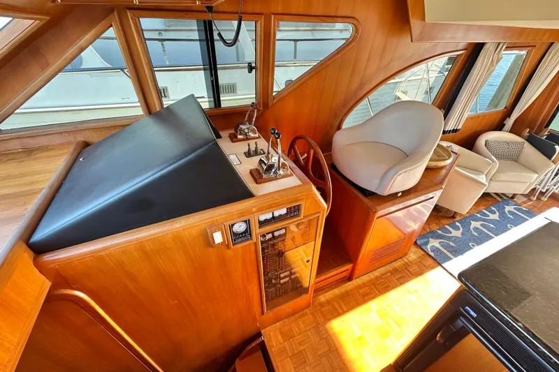 Slide: The Image of Interior of 2003 Ocean Alexander 42 Sport Sedan with helm station and seating area. - 14