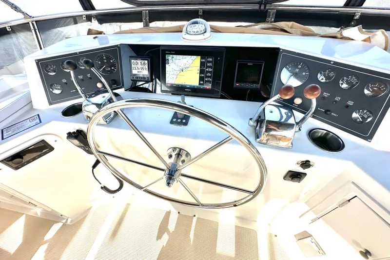 Slide: The Image of Helm of 2003 Ocean Alexander 42 Sport Sedan with navigation instruments and steering wheel. - 27
