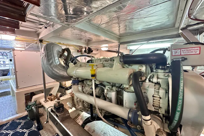 Slide: The Image of Engine room of 2003 Ocean Alexander 42 Sport Sedan yacht, showcasing detailed machinery. - 33