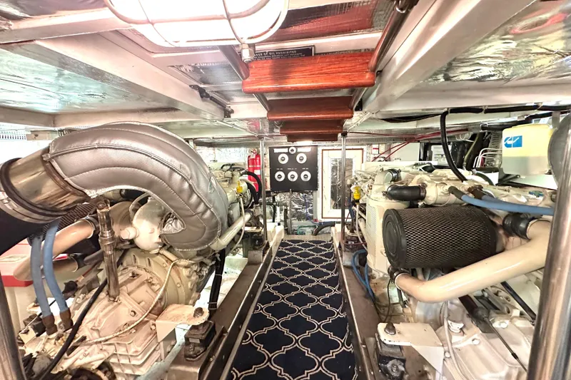 Slide: The Image of Engine room of 2003 Ocean Alexander 42 Sport Sedan with dual engines and control panel. - 34