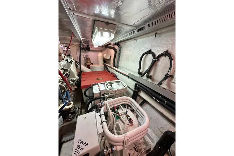 Slide: The Image of Engine room of 2003 Ocean Alexander 42 Sport Sedan with visible machinery and wiring. - 35
