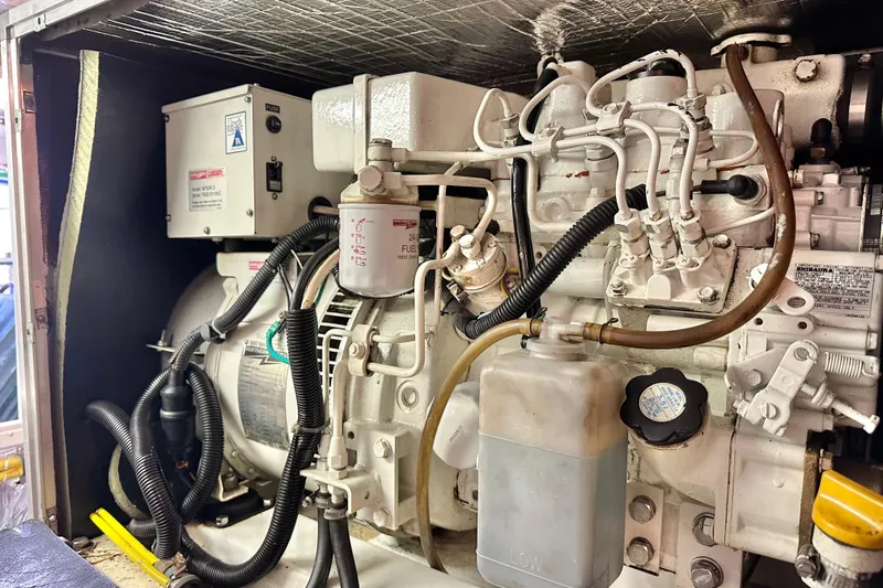 Slide: The Image of Engine compartment of 2003 Ocean Alexander 42 Sport Sedan, showcasing mechanical components and wiring. - 37