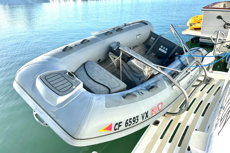 Slide: The Image of Inflatable dinghy on Ocean Alexander 42 Sport Sedan, 2003, docked on calm water. - 6