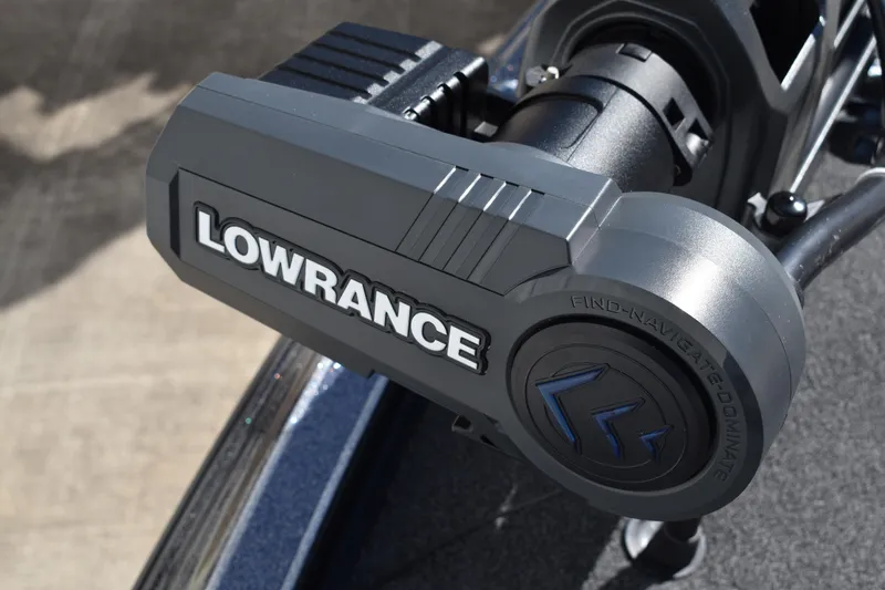 Slide: The Image of 2025 Triton 20XP Patriot boat deck with Lowrance electronics, featuring spacious storage compartments. - 15