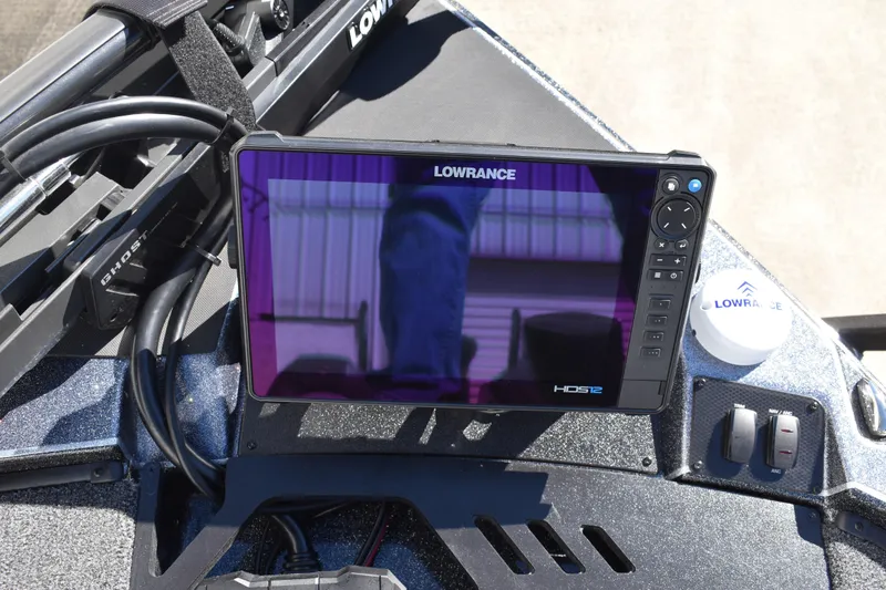 Slide: The Image of 2025 Triton 20XP Patriot boat deck with textured surface and metallic accents. - 18