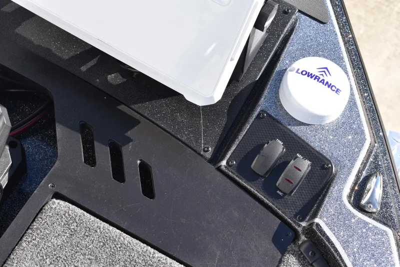 Slide: The Image of 2025 Triton 20XP Patriot boat interior with open storage compartment. - 19