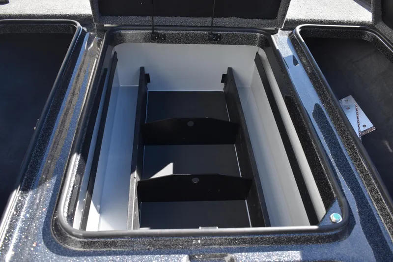 Slide: The Image of Open storage compartment of 2025 Triton 20XP Patriot boat. - 22