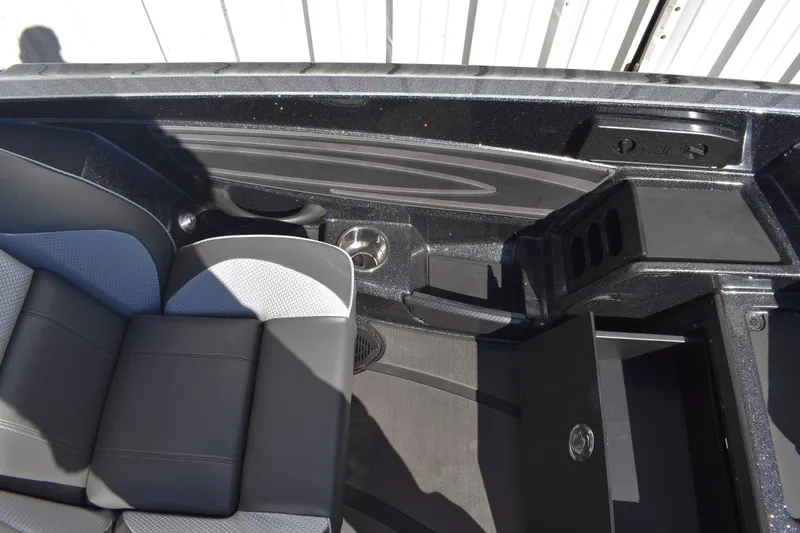 Slide: The Image of Storage compartment of 2025 Triton 20XP Patriot boat, featuring organized interior layout. - 24