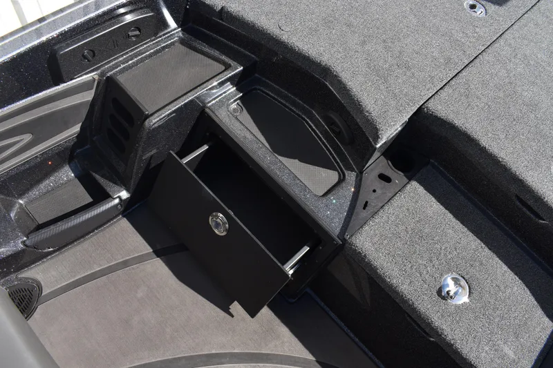 Slide: The Image of 2025 Triton 20XP Patriot dashboard with sleek black display and steering wheel detail. - 26