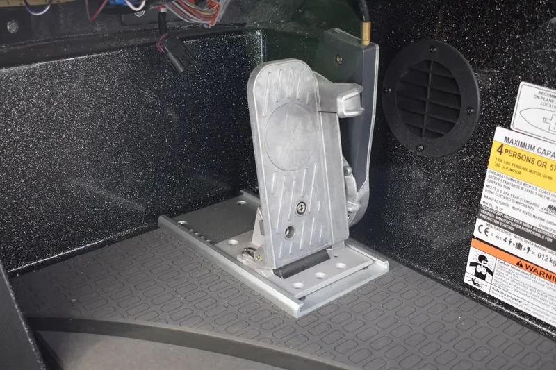 Slide: The Image of 2025 Triton 20XP Patriot boat storage compartments with open lids, showcasing interior design. - 34