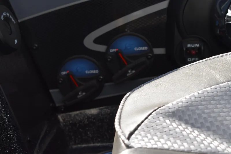 Slide: The Image of 2025 Triton 20XP Patriot boat deck with gray carpet and seating. - 35