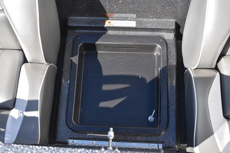 Slide: The Image of 2025 Triton 20XP Patriot drain plug on glittery surface. - 37