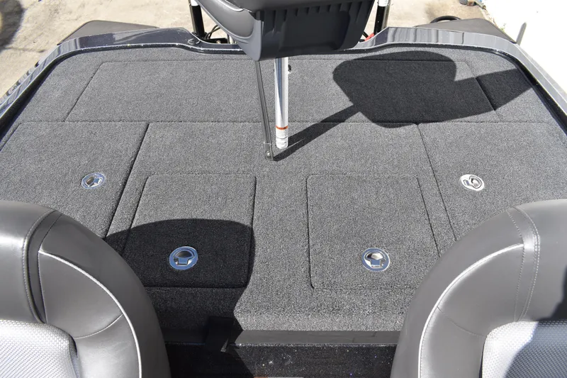 Slide: The Image of 2025 Triton 20XP Patriot boat storage compartments with open lids. - 38