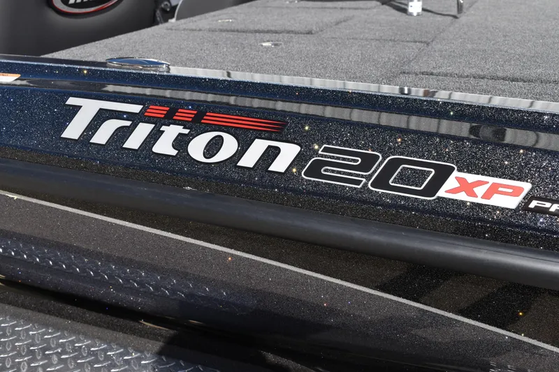 Slide: The Image of Trailer hitch and steps of 2025 Triton 20XP Patriot boat trailer. - 5