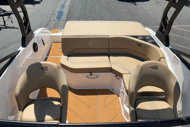 Slide: The Image of 2025 Bayliner V20i boat interior with beige seating and modern design. - 16