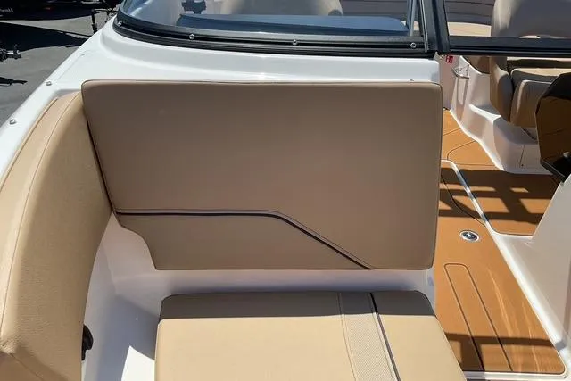 Slide: The Image of 2025 Bayliner V20i boat interior with tan seating and sleek design. - 9