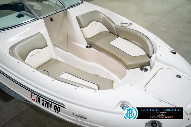 Slide: The Image of 2005 Sea Ray 200 Sundeck boat on trailer in indoor showroom. - 12