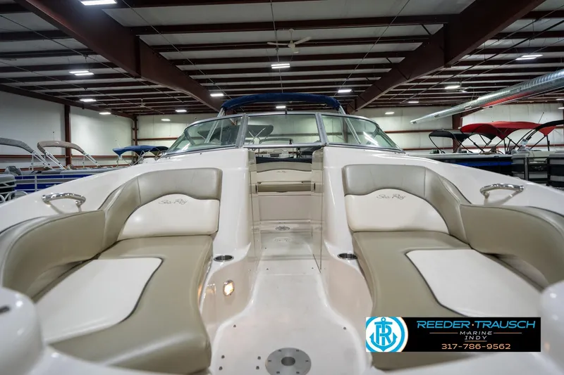 Slide: The Image of 2005 Sea Ray 200 Sundeck boat interior with seating and steering console. - 16