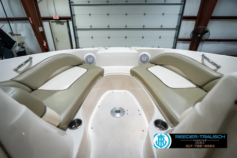 Slide: The Image of 2005 Sea Ray 200 Sundeck interior seating in a boat showroom. - 22