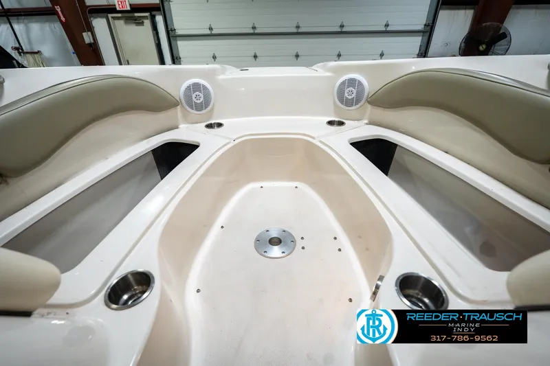 Slide: The Image of Interior view of 2005 Sea Ray 200 Sundeck boat with beige seating. - 23