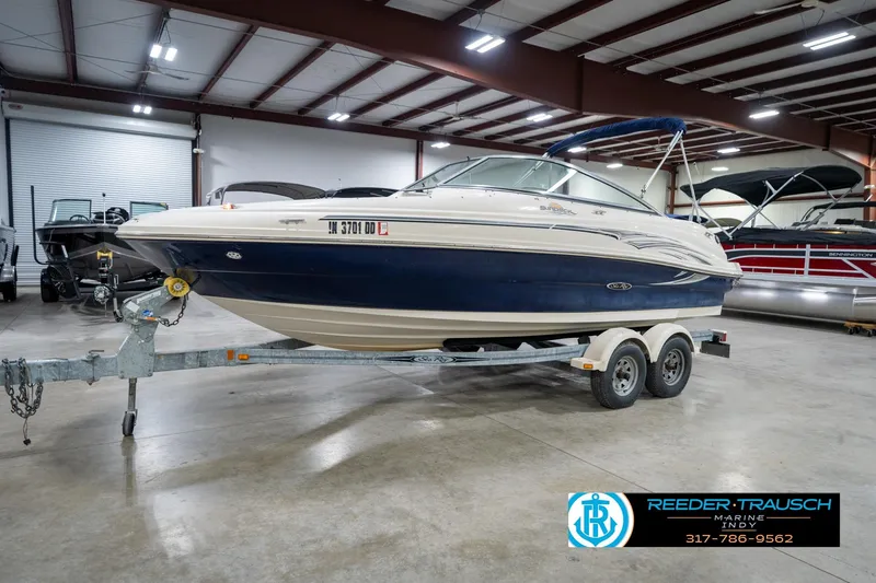 Slide: The Image of 2005 Sea Ray 200 Sundeck boat on trailer in indoor showroom. - 3