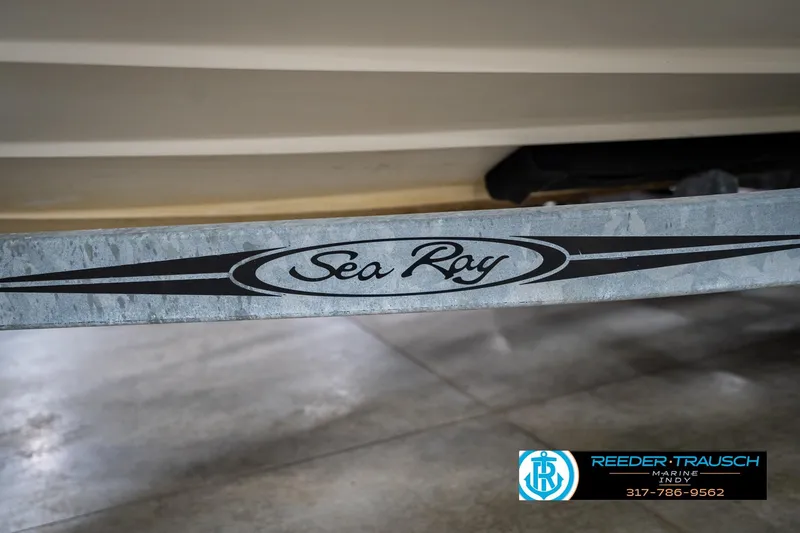 Slide: The Image of 2005 Sea Ray 200 Sundeck boat with MerCruiser outdrive in a showroom. - 45