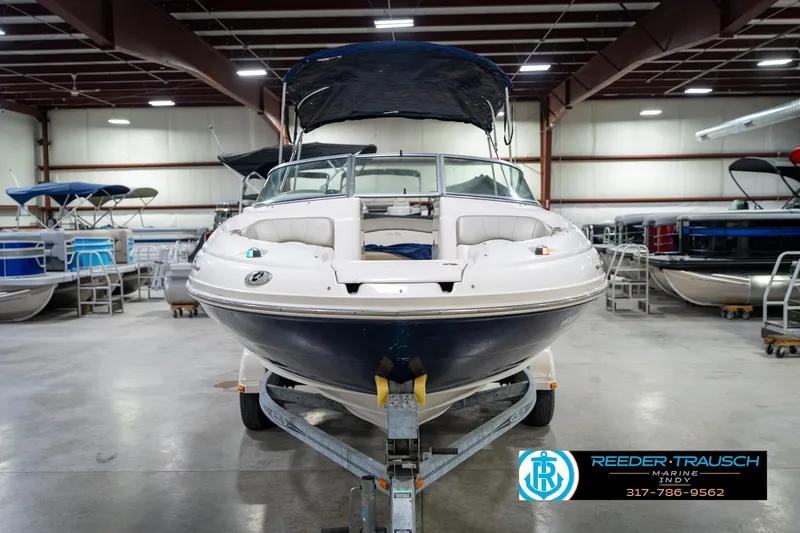Slide: The Image of 2005 Sea Ray 200 Sundeck boat on trailer in indoor showroom. - 5